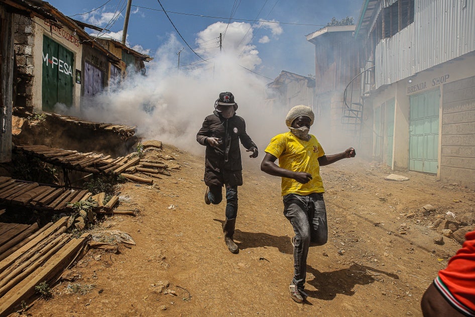 People run away from teargas