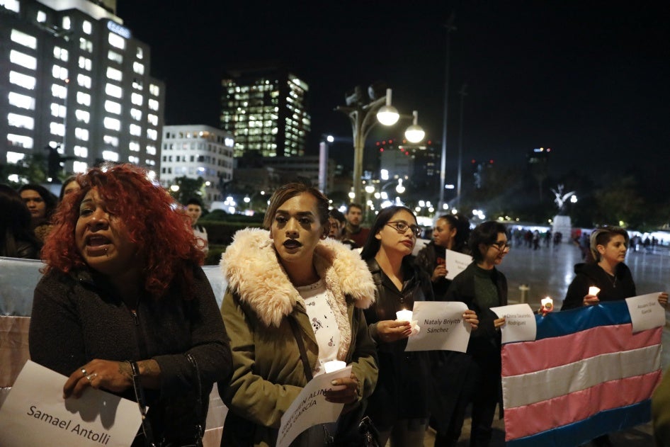  People carry the names of murdered transgendered women as dozens of transgender women and allies gather to commemorate murdered members of their community on Transgender Day of Remembrance in Mexico City.