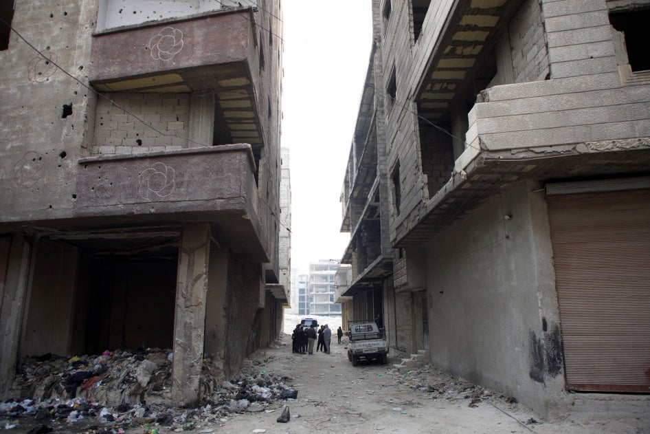 Human Rights Watch researchers visit the site of the mass grave in Tadamon, Damascus on December 11, 2024. Human Rights Watch confirmed the mass grave’s exact location after verifying a leaked video, taken in April 2013, showing summary executions by Syrian government forces and affiliated militia. 