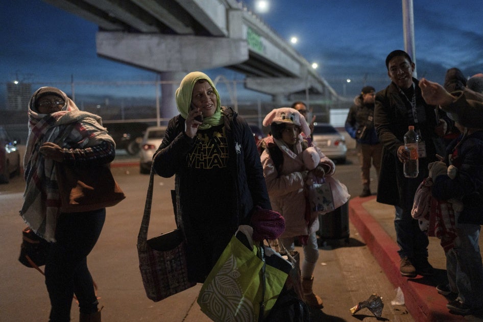 A group of migrants wait after learning that their appointments to apply for asylum in the US have been canceled.