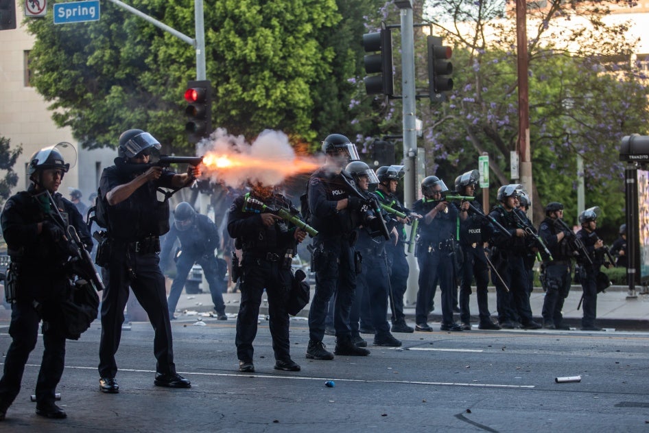 Los Angeles Police Department officers shoot kinetic impact projectiles at protesters outside City Hall  in Los Angeles, California, on June 8, 2025. © 2025 Apu Gomes/Getty Images