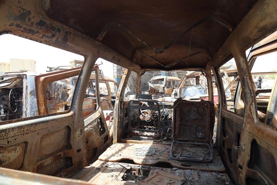 Burned-out cars lined up by the Jarman petrol station, which was struck in an aerial attack on April 15, 2015.