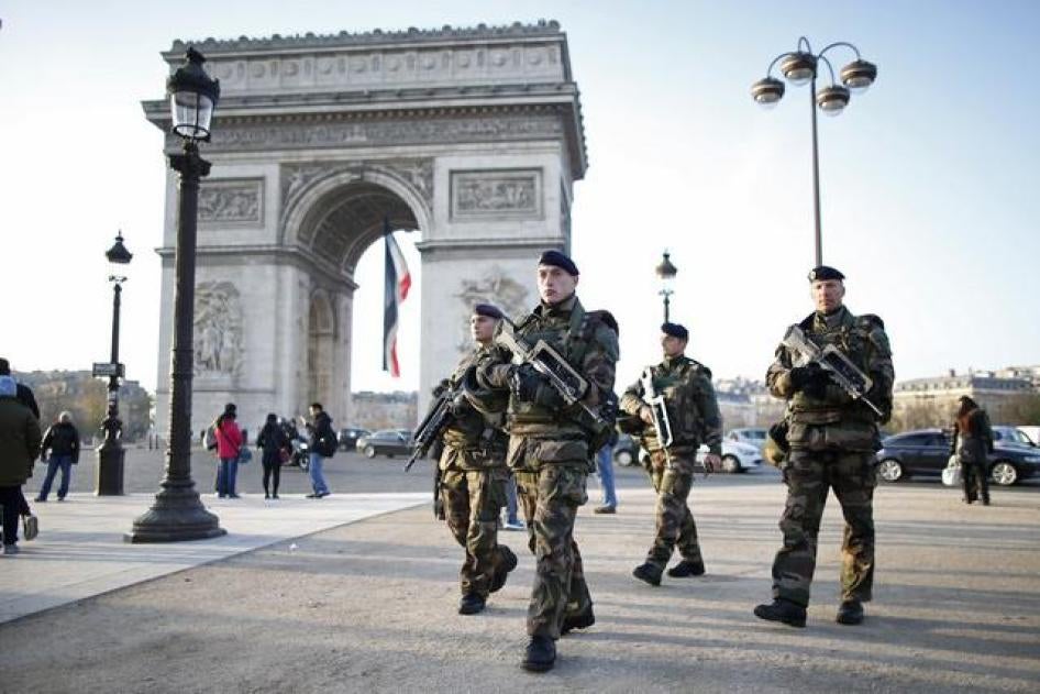 French soldiers patrol in front of the Arc de Triomphe on the Champs Elysees avenue in Paris, France