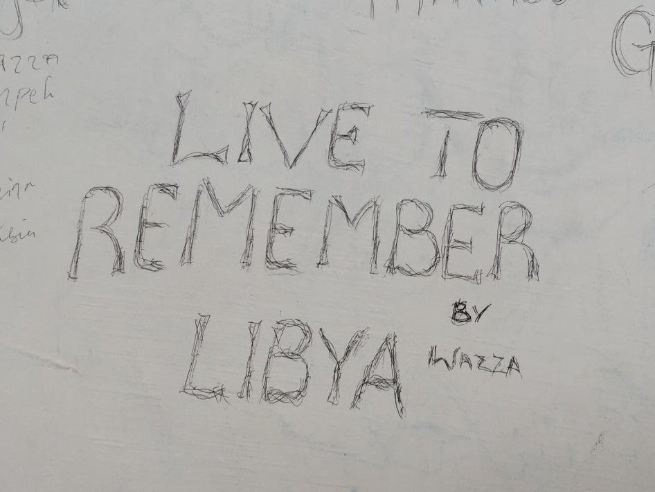 Graffiti by migrants at the Pozzallo reception center on Sicily, Italy.
