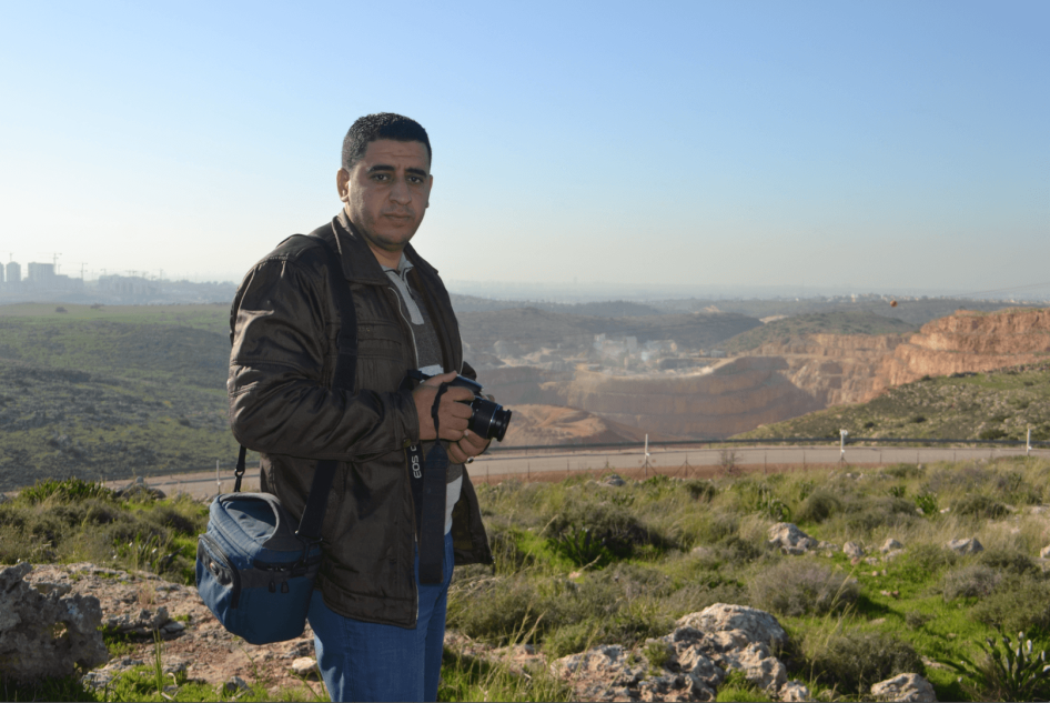Azmi Shuqeir, of the West Bank village of Zawiya, in front of a quarry that a multinational company operates on land confiscated by Israel. 