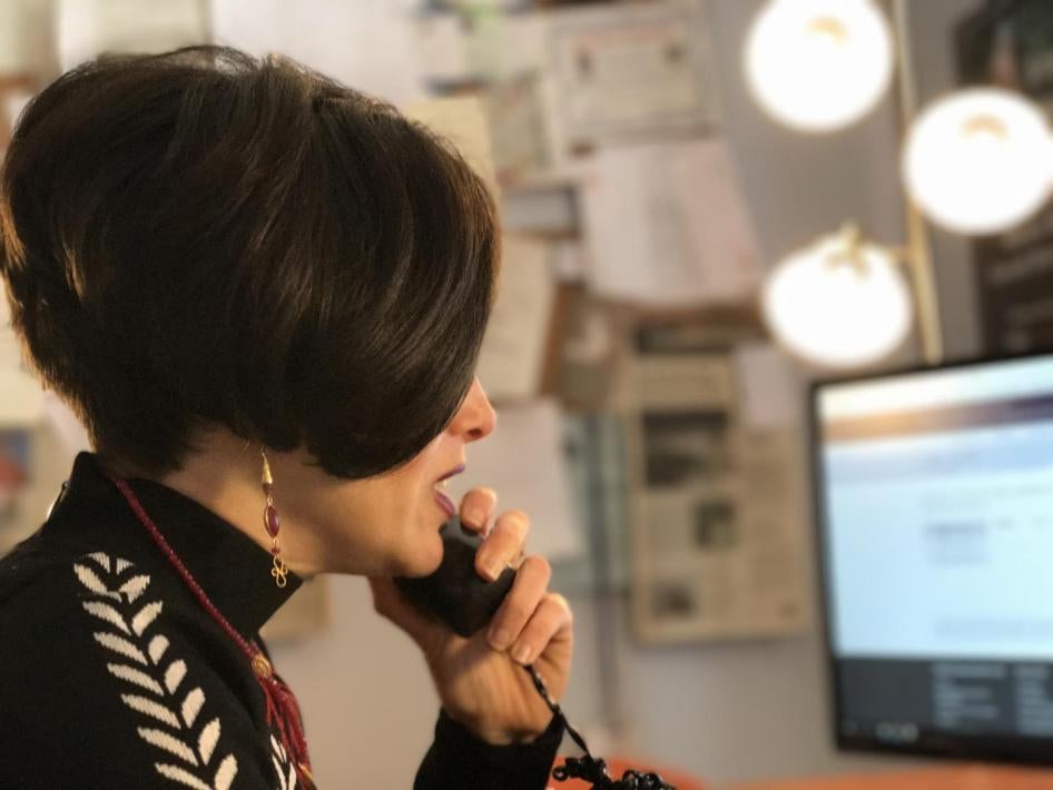 Fraidy Reiss taking a call at her desk.