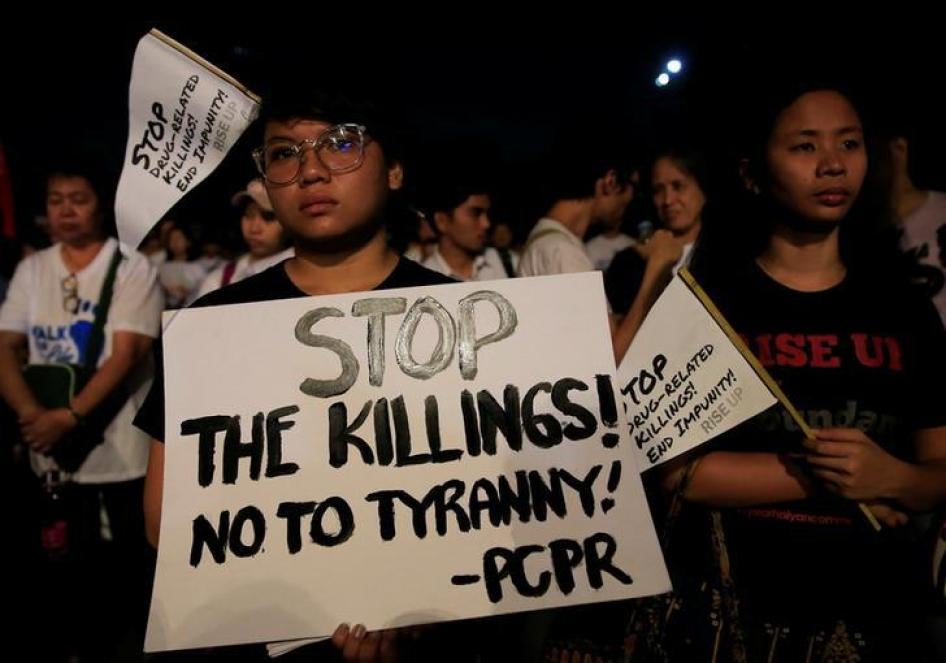 Participants display placards as they participate in a procession against plans to reimpose death penalty and intensify drug war during "Walk for Life" in Luneta park, Metro Manila, Philippines February 24, 2018. 