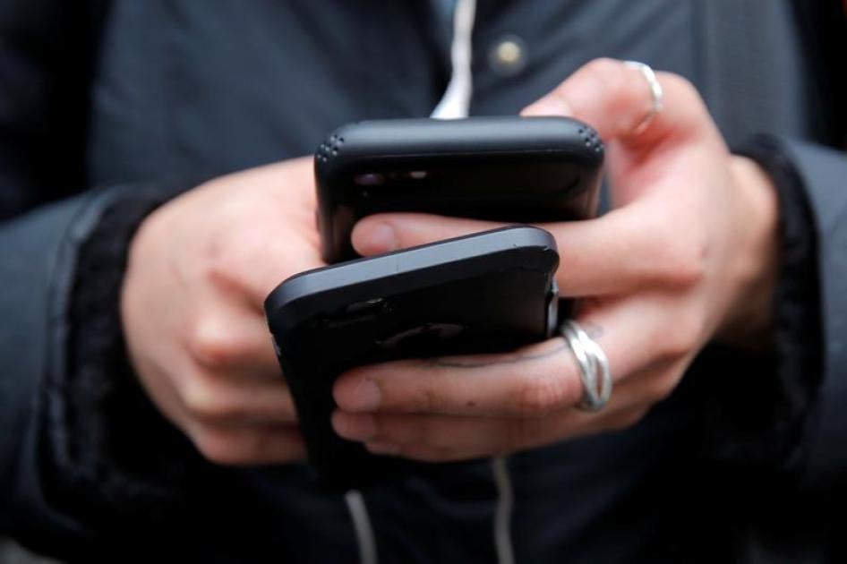 A woman uses her cell phones in Manhattan, New York, U.S., January 30, 2018.