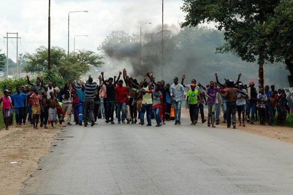 Protesters block the main route to Zimbabwe's capital, Harare, from Epworth township on January 14 2019 after a hike in fuel prices was announced. © 2019 JEKESAI NJIKIZANA/AFP/Getty Images