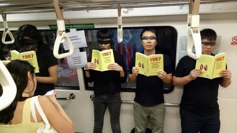 Jolovan Wham participates in a silent protest with eight other activists on an MRT train in Singapore, June 3, 2017