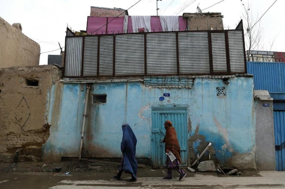 Women walk along a street in the old part of Kabul February 29, 2020. 