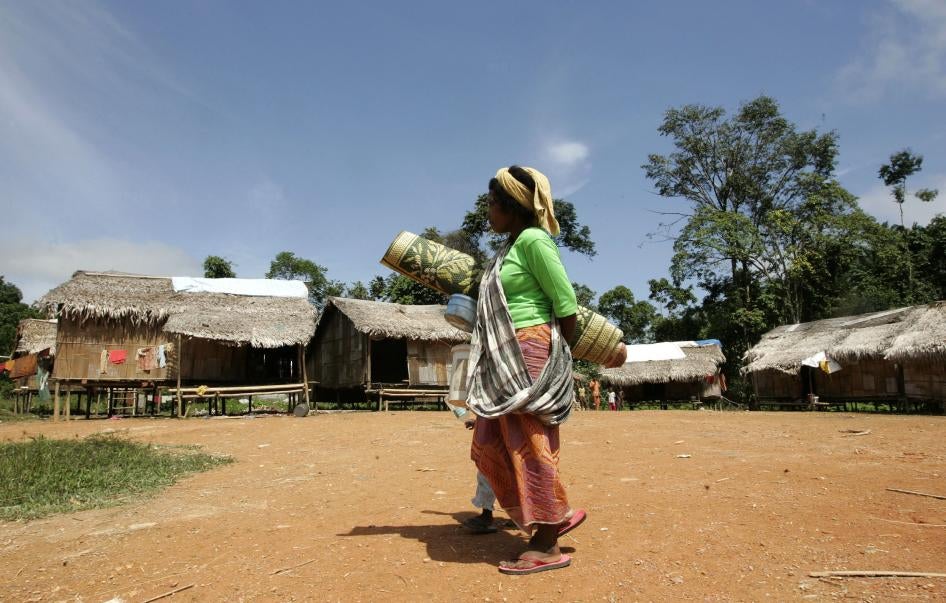 A Batek woman walks near her village in Kuala Koh, Kelantan, Malaysia.