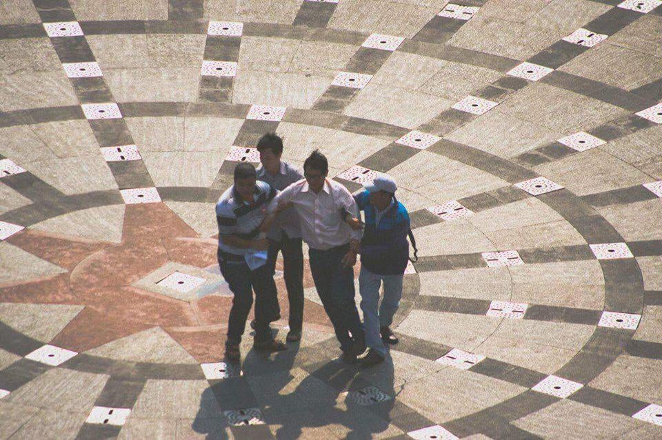 Plainclothes security forces drag away blogger Huynh Ngoc Chenh.