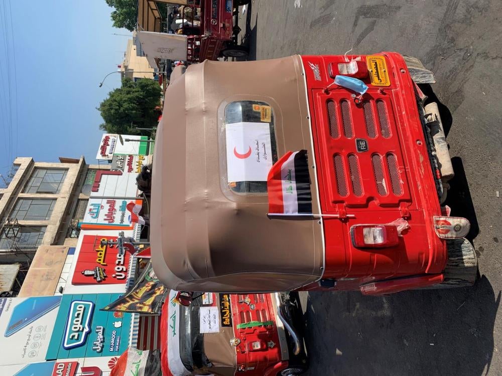 A tuk-tuk functioning as a makeshift ambulance for protesters injured in Tahrir Square.