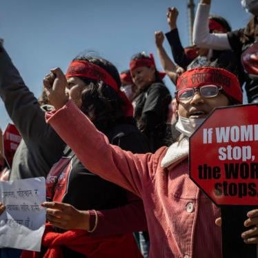 Women hold placards during a protest against sexual violence in Kathmandu, Nepal