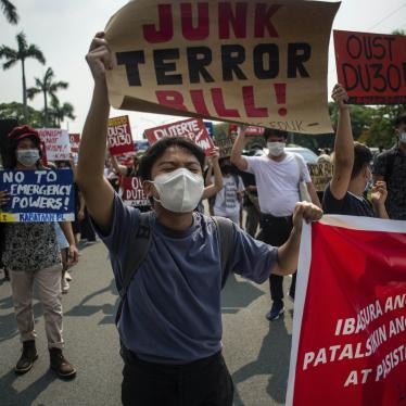 A protester carries a sign at a rally against the draft Anti-Terrorism Act in Quezon City, Philippines, June 4, 2020.