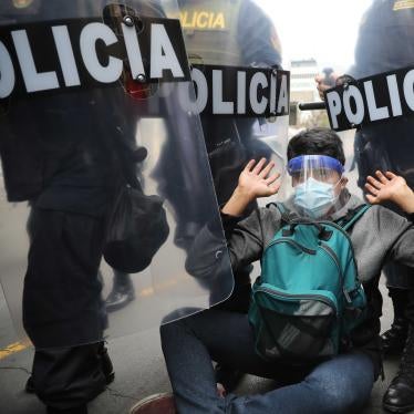 Police surround a protester in Lima, Peru, Tuesday, Nov. 10, 2020.