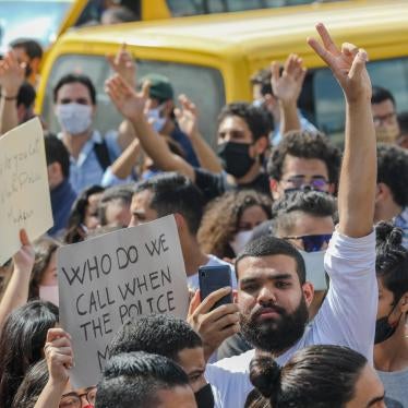 Saif Ayadi, LGBT rights activist at Damj Association, surrounded by protesters on October 6, 2020.