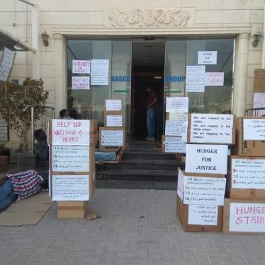 Former and current employees of Imperial Trading and Construction Company (ITCC) protest months of delayed and unpaid wages outside the company's headquarters. 