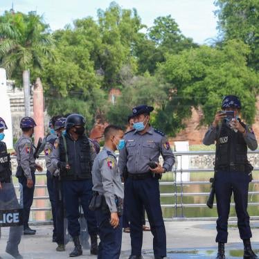 Police officers wearing facemasks stand on a street in Yangon, Myanmar, November 3, 2020. 
