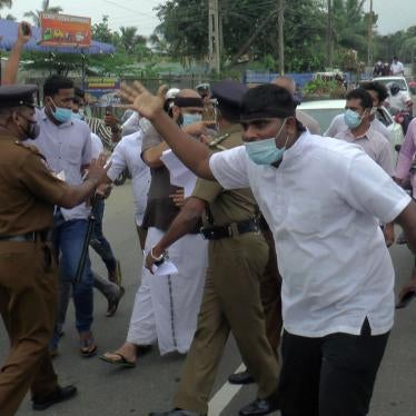 Police try to stop supporters of Sri Lanka's Tamil National Alliance marching in Addalaichenai, Sri Lanka, February 3, 2021.