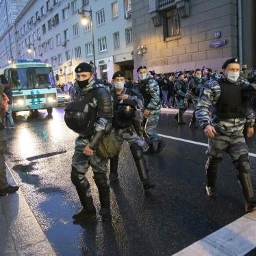 Police officers block a road in Russia’s capital