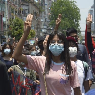 Anti-coup protesters flash the three-finger sign of defiance during a demonstration in Yangon, Myanmar on April 23, 2021.