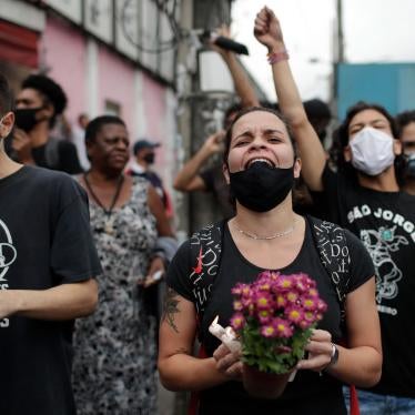 Activists and relatives of victims shout slogans and demand justice the day after a deadly police operation in the Jacarezinho favela of Rio de Janeiro, Brazil, May 7, 2021.