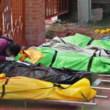 A family member mourns next to the bodies of COVID-19 victims at a crematorium near Pashupatinath temple in Kathmandu, Nepal, May 7, 2021. (AP Photo/Niranjan Shrestha)