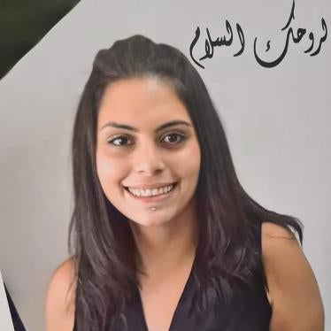 A picture of Suha Jarrar and flowers prepared by the staff of the Palestinian human rights group al-Haq and displayed at a commemoration for Jarrar in Ramallah in the Israeli-occupied West Bank on July 12, 2021 