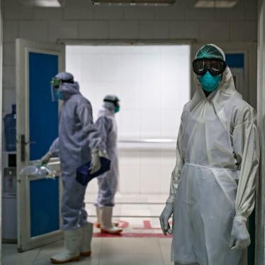A medical worker wearing full protective gear stands at the gate of the intensive care unit of a hospital, where coronavirus (Covid-19) patients are treated in Sanaa, Yamen, on June 15, 2020.