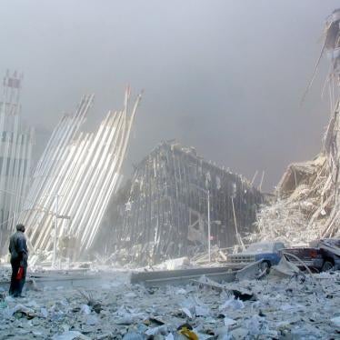 A man stands in the rubble after the collapse of the first World Trade Center Tower in New York City on September 11, 2001.