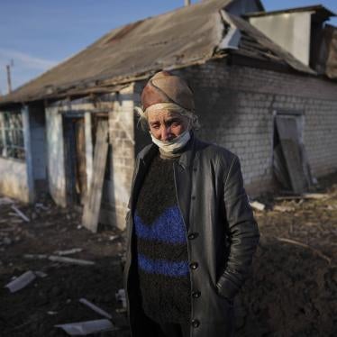 Tetyana Tomenko in front of her house, which was damaged during shelling in Novognativka, eastern Ukraine, February 20, 2022.