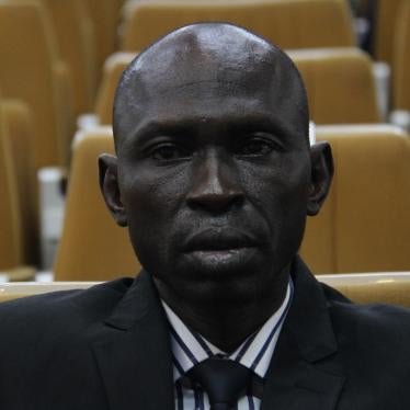 A man sits facing the camera