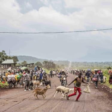 People flee fighting between Congolese troops and M23 rebels near Kibumba, north of Goma.