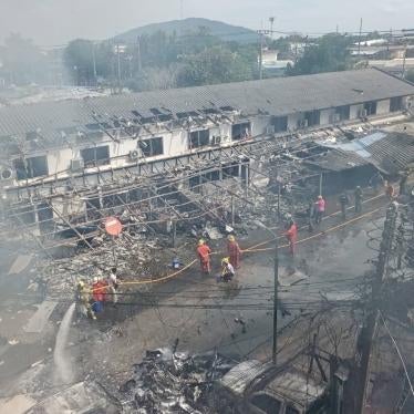 Aftermath of a bombing; side of a building is destroyed