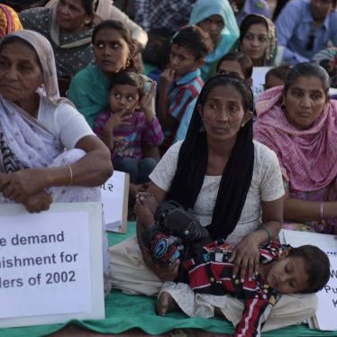 Victims of the 2002 anti-Muslim riots in Gujarat state, which left more than 1,000 dead, gather for a protest