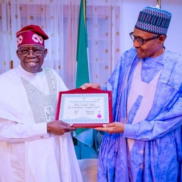 Nigerian President Muhammadu Buhari (R) and Nigeria's newly declared winner of 2023 presidential election, Bola Ahmed Tinubu (L) pose for a photograph in Daura, Nigeria, March 1, 2023. 