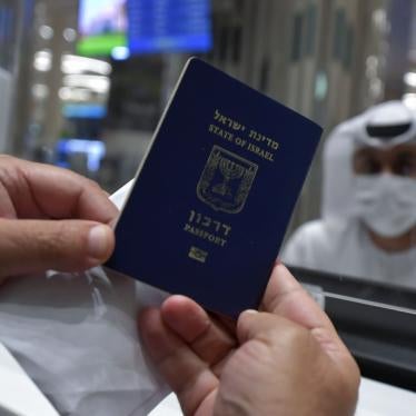 An Israeli man presents his passport for control upon arrival from Tel Aviv to the Dubai airport in the United Arab Emirates, on November 26, 2020.