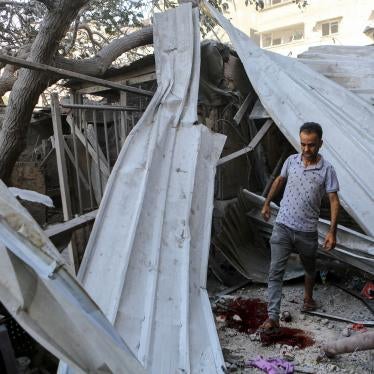 A man walks through the rubble of Israeli strikes in Gaza City, October 15, 2023. 