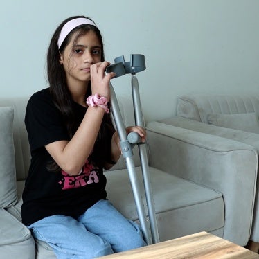 Dana Dabour, 12, sits in an apartment in Doha, Qatar