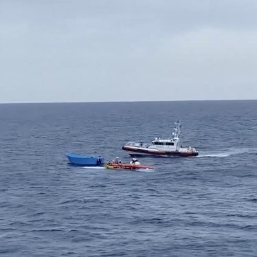 A Libyan coast guards patrol boat approaches a Médécins Sans Frontières (MSF) team performing a rescue in the central Mediterranean Sea, September 19, 2024.