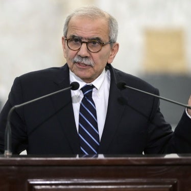 Lebanese Prime Minister-designate Nawaf Salam holds up a copy of the Lebanese Constitution as he speaks at the presidential palace in Baabda, Lebanon, January 14, 2025. 