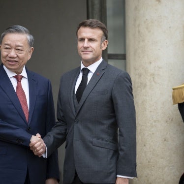 France's President Emmanuel Macron (R) greets Vietnam's President To Lam at the Elysee Palace in Paris, October 7, 2024.