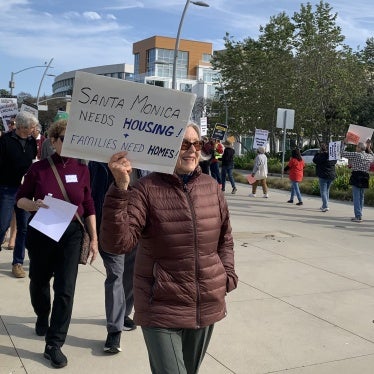 Santa Monica, California residents and workers gather at City Hall to demand affordable housing at the municipal airport site. 