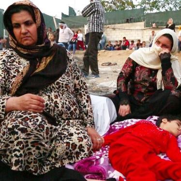 Screenshot taken from video footage of an Afghan woman with her 15-year-old daughter who has multiple disabilities on the ground outside the Moria registration camp on the Greek island of Lesbos. October 5, 2015.