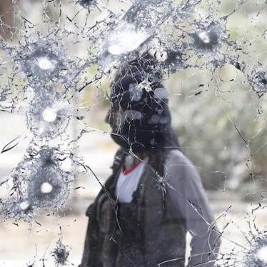An anti-Houthi fighter stands guard at Aden international airport, which has been badly damaged due to fighting in the city since March 2015, on July 24, 2015 in Aden, Yemen.