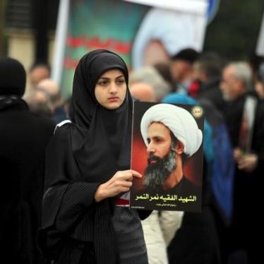A girl carries a picture of Sheikh Nimr al-Nimr, who was executed along with 46 others in Saudi Arabia, during a protest against the execution in front of the United Nation's building in Beirut, Lebanon.