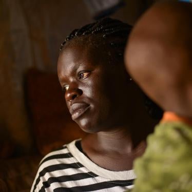 Fatma W. with her 7-year-old son born from rape.