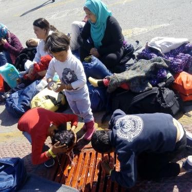 Children washing outside a makeshift camp for asylum seekers and migrants at the port of Piraeus, in Athens. The UN refugee agency, UNHCR, estimates that women and children now make up nearly 60 per cent of those seeking refuge in Europe.